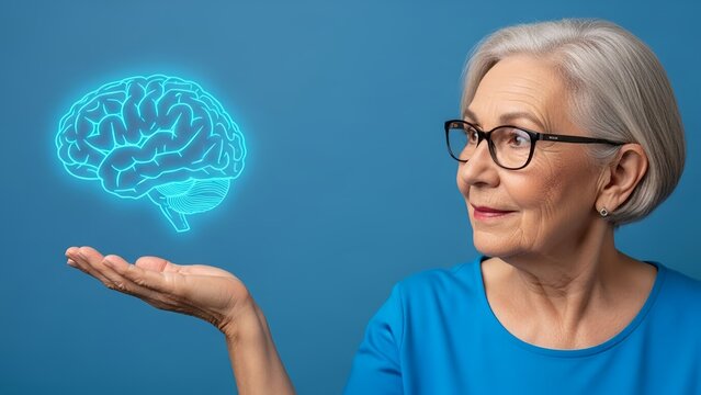Brain holographic projection held by a senior woman wearing glasses against a plain blue background