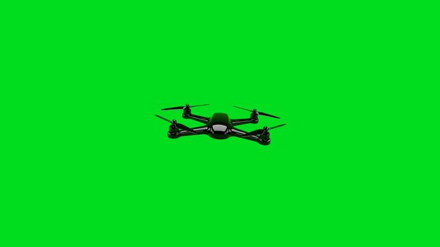A sleek black quadcopter drone hovering against a solid vibrant green screen