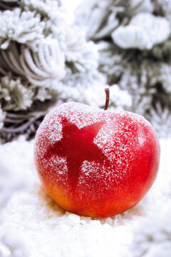 Christmas apple with snow, close-up