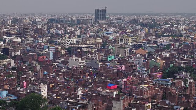 Aerial view of Patna, Bihar, India, showcasing the dense urban landscape, residential buildings, modern infrastructure, and busy roads of the city.