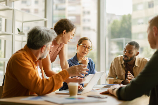 Business professionals plan new ideas during an office meeting