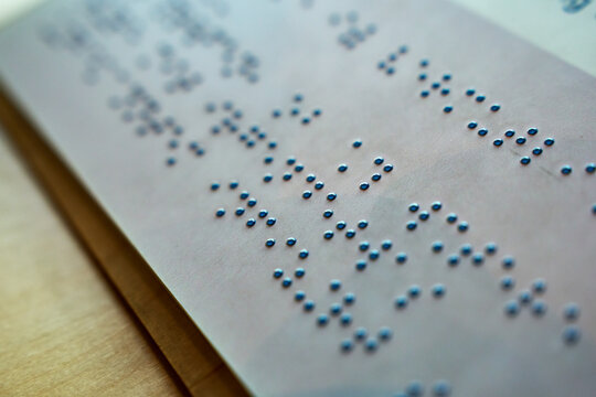 Braille Text with Raised Dots on Paper