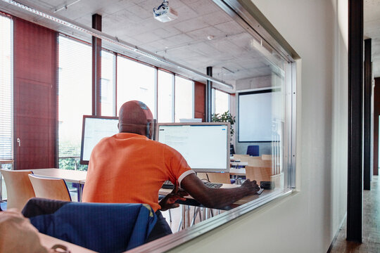 Man using computer in training room