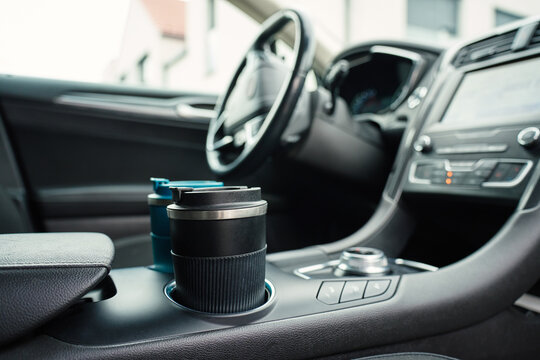 Reusable coffee mugs in car cup holders