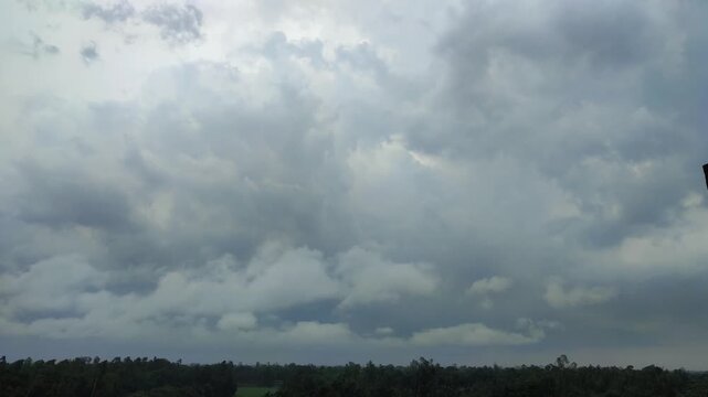 Dramatic Overcast Sky With Thick Storm Clouds Over A Forested Horizon Before Rain