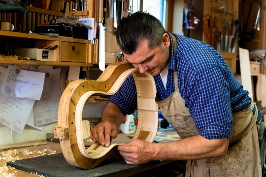 Guitar maker in his workshop