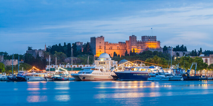 Greece, Rhodes, ships at Mandraki harbour and Palace of the Grand Master