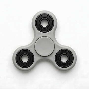 Grey plastic fidget spinner toy with dark circular bearings isolated on a clean white studio background
