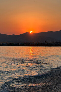 2026 Solar Eclipse View from Chiavari Fishing Village during a Sunny Summer Evening. Beautiful Natural Phenomenon. Genoa Province, Italy