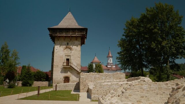 Explore the old walls and tower of Humor monastery in Bukovina. See the history and artwork from a time long past in this quiet place of worship.