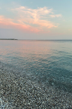 Colorful Seascape during a Summer Sunset in Chiavari Village. Beautiful Pink Clouds Reflected on the Water. Beautiful Atmosphere. Genoa Province, Liguria, Italy