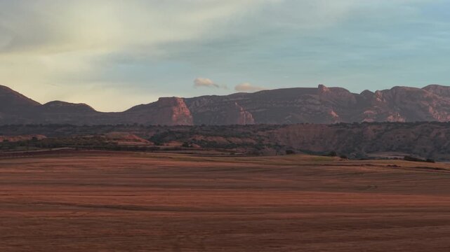Roldan Cliffs Beyond Farmland at Sunrise in Aragon Spain