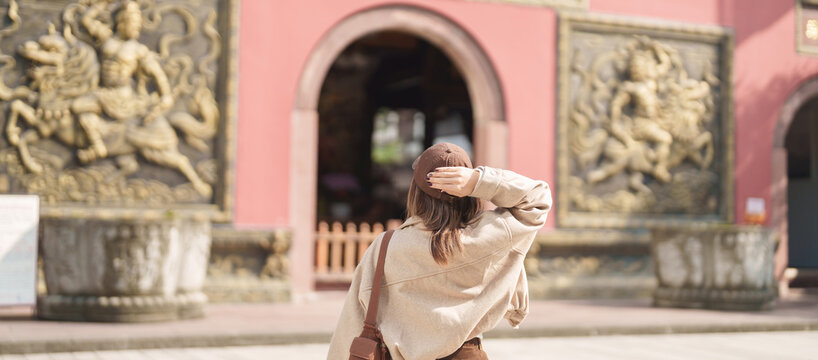 woman traveler travel in Chengdu city. Happy Tourist sightseeing in Daci Temple is a Buddhist temple . Famous Landmark for tourism attraction in Sichuan, China