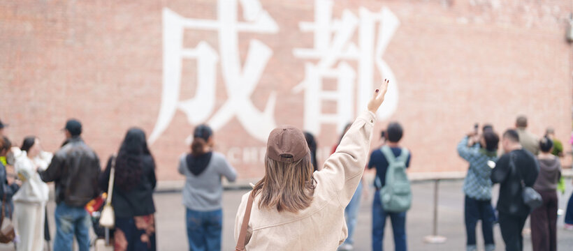 Happy woman traveler travel in Chengdu city. Tourist sightseeing and shopping in Eastern Suburb Memory or Dongjiao Ji Yi. Famous Landmark for tourism attraction in Sichuan, China