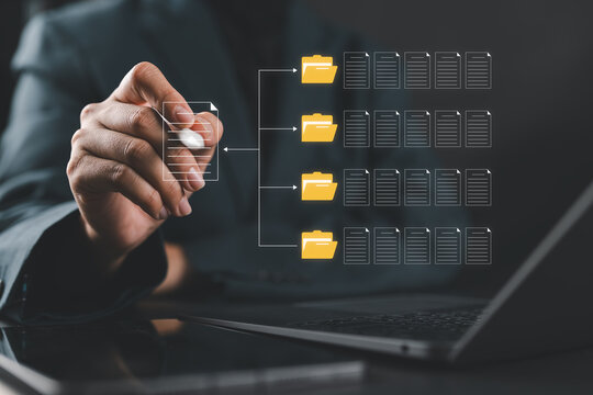 Document classification and file organization. Corporate analyst using a laptop and folders. Digital archive management, automated sorting, workflow efficiency, data categorization, document control
