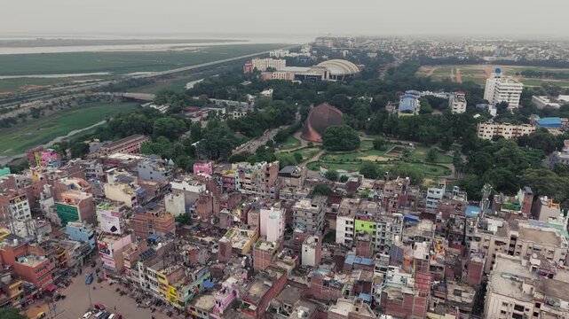 Aerial drone view of Golghar, a massive dome-shaped historic granary in Patna, Bihar, India. The iconic 18th-century monument is surrounded by lush greenery and the urban landscape of Patna