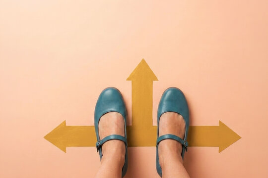 Woman in blue shoes standing at crossroads choosing path and direction