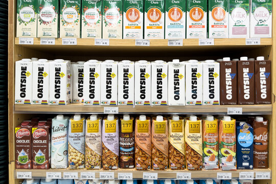 PENANG, MALAYSIA - JUL 03, 2026: Assorted plant based milk and dairy beverages displayed on supermarket retail shelves.