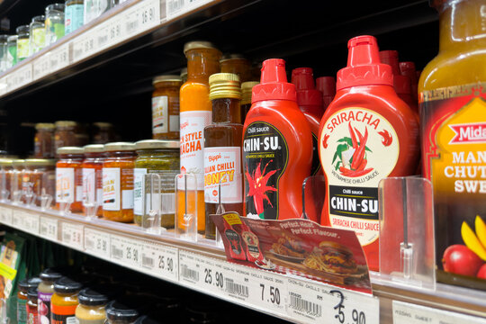 PENANG, MALAYSIA - JUL 06, 2026: Chin Su Sriracha chilli sauce displayed on supermarket condiment shelf.
