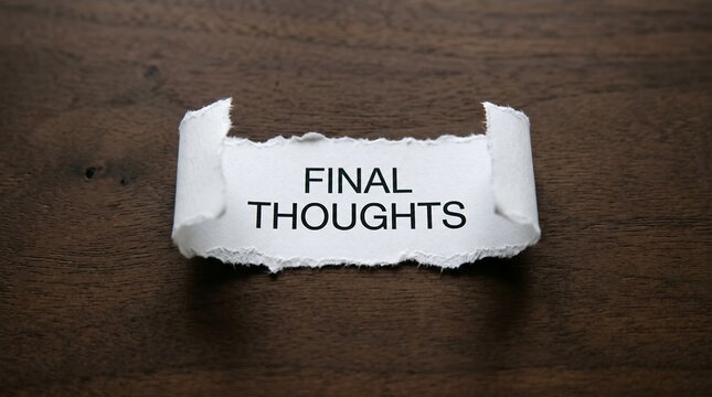 A piece of white torn paper with the text final thoughts printed on it lies centered horizontally across a dark brown textured wooden tabletop surface under warm lighting
