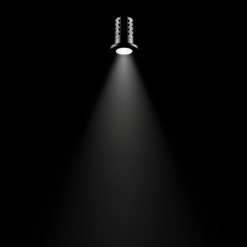 Spotlight beam shining in dark background