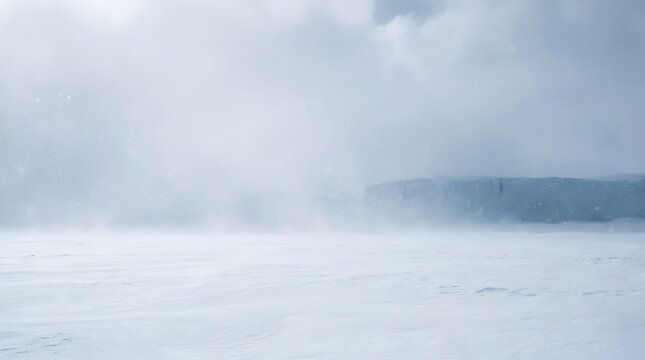 Frozen lake landscape with misty mountains in winter
