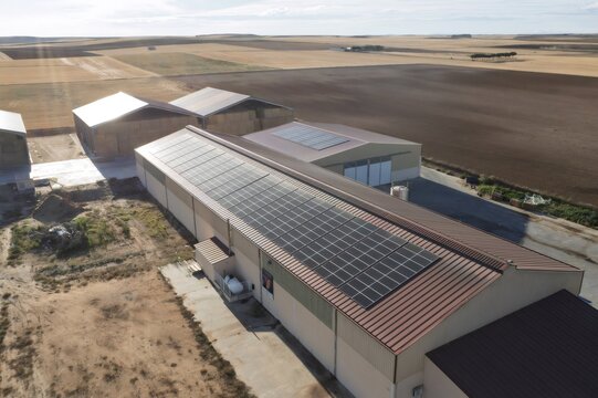 Farm buildings with solar panels generating renewable energy