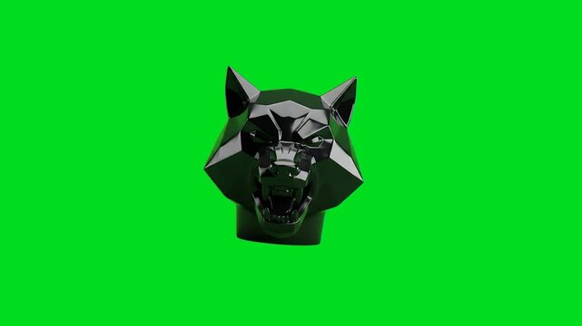 A fierce black geometric wolf head sculpture isolated on a bright green backdrop