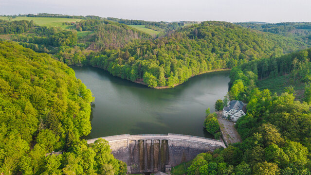 Aerial view of Biggedamm dam and forested Biggesee reservoir in Germany