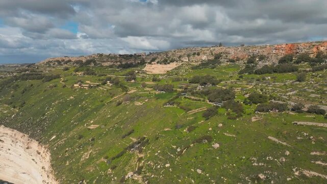 Aerial Dolly In Revealing Dingli Coastal Cliffs, Agricultural Fields and Mediterranean Village, Malta