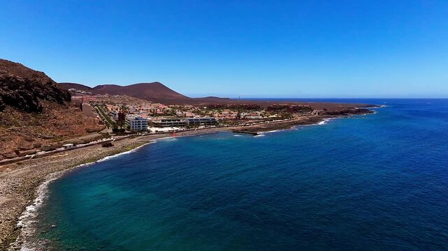 High-altitude aerial view of coastal infrastructure and fish farming facilities at Punta del Bocinegro in Tenerife, Canary Islands