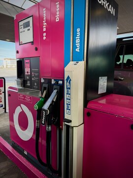 Reykjavik, Iceland - May 08, 2026: Pink fuel pump at a gas station displaying diesel and AdBlue options with visible branding and dispensers
