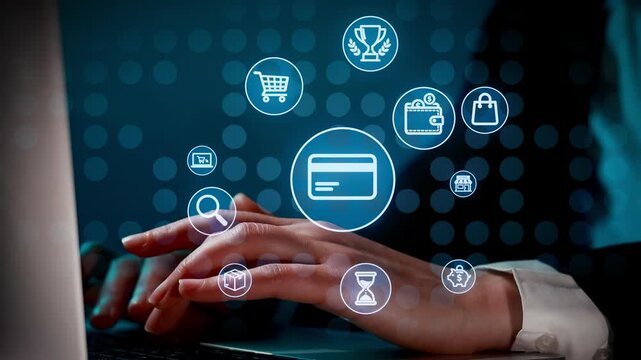 A person uses a laptop to shop online. Various payment icons appear on the screen. This scene shows the process of online transactions in a home or office setting.
