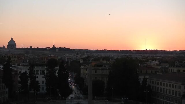 Panorama with orage sky after sunset, city center, busy street Via Cola di Rienzo with car headlights, horizon with dome of Basilica of St. Peter and Monte Mario Hill - view from Pincio Hill in Rome.