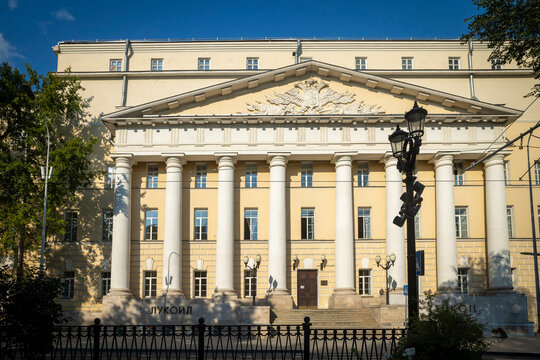 Moscow, Russia, August 5, 2026 &mdash; Lukoil Headquarters Building, a Neoclassical Mansion with Ionic Columns, Triangular Pediment, and Double-Headed Eagle Relief. Pokrovsky Barracks, the First Barracks