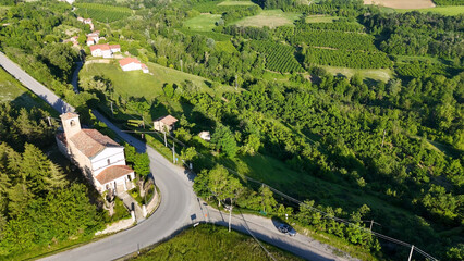 Naklejka premium Aerial View of a Historic Church in Piedmont Italy Countryside