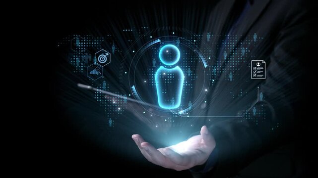 A business person stands with an open hand displaying holographic digital data visualizations, symbolizing technology and innovation in modern corporate practices. Qubit