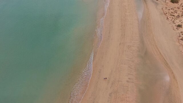 Aerial view of Sotavento beach in Jandia which is nine kilometer long virgin beach in Fuerteventura. Scenic Drone POV Exploration of Fuerteventura island.