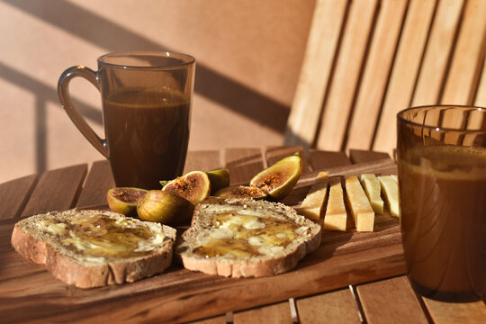 Rustic Mediterranean summer snack with figs, honey and cheese