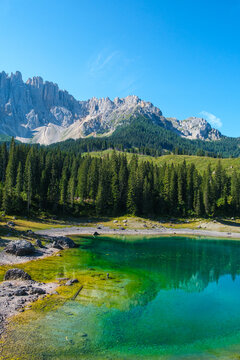Dolomites mountain azure lake landscape with reflection in Italy, scenic European Alps turquoise water and nature travel concept