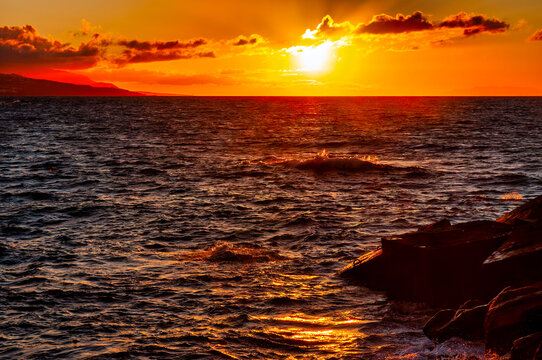 Puerto De La Cruz Coast With Intense Orange Sunset
