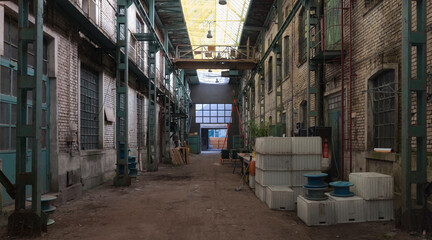 Fototapeta premium Abandoned old industrial textile research institute with laboratory chemistry glass, machinery workshop and factory hall