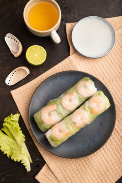 Vietnamese shrimp spring rolls on black concrete. top view, flat lay, close up