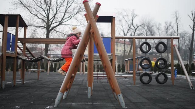 little girl playing on playground