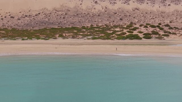 Aerial view of Sotavento beach in Jandia which is nine kilometer long virgin beach in Fuerteventura. Scenic Drone POV Exploration of Fuerteventura island.