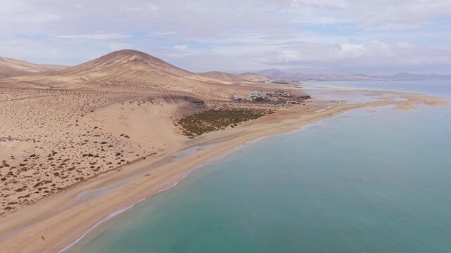 Aerial view of Sotavento beach in Jandia which is nine kilometer long virgin beach in Fuerteventura. Scenic Drone POV Exploration of Fuerteventura island.