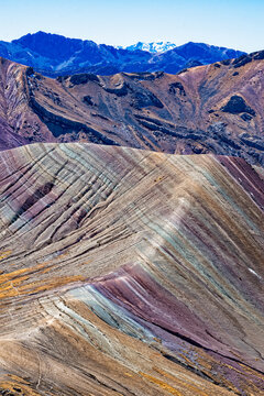 Peru, South America: aerial view of Palccoyo rainbow mountain, a mountain range in the Andes, 5.000 meters above sea level, with colourful stripes caused by natural mineral and clay weathering
