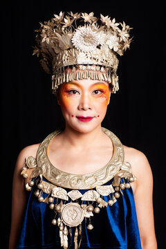Asian Dai ethnic minority woman against a black background