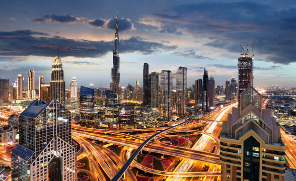 Panorama of skyline downtown Dubai - Aerial view at night, United Arab Emirates