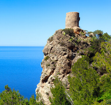 Torre del Verger on a cliff overlooking the sea in Mallorca, Spain